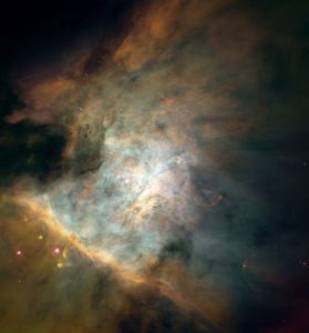 This spectacular color panorama of the center the Orion nebula is one of the largest pictures ever assembled from individual images taken with NASA's Hubble Space Telescope. The picture, seamlessly composited from a mosaic of 15 separate fields, covers an area of sky about five percent the area covered by the full Moon. The seemingly infinite tapestry of rich detail revealed by Hubble shows a churning turbulent star factory set within a maelstrom of flowing, luminescent gas. Though this 2.5 light-years wide view is still a small portion of the entire nebula, it includes almost all of the light from the bright glowing clouds of gas and a star cluster associated with the nebula. The mosaic reveals at least 153 glowing protoplanetary disks (first discovered with the Hubble in 1992, and dubbed "proplyds") that are believed to be embryonic solar systems that will eventually form planets. (Our solar system has long been considered the relic of just such a disk that formed around the newborn Sun). The proplyds that are closest to the Trapezium stars (image center) are shedding some of their gas and dust. The pressure of starlight from the hottest stars forms "tails" which act like wind vanes pointing away from the Trapezium. These tails result from the light from the star pushing the dust and gas away from the outside layers of the proplyds. In addition to the luminescent proplyds, seven disks are silhouetted against the bright background of the nebula. Located 1,500 light-years away, along our spiral arm of the Milky Way, the Orion nebula is located in the middle of the sword region of the constellation Orion the Hunter, which dominates the early winter evening sky at northern latitudes.
